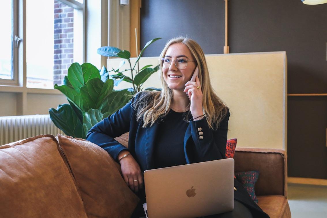Smiling woman on call